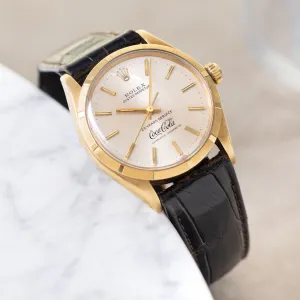 Rolex Oyster -Perpetual  silver "25 years Coca Cola service " logo dial   in 18 k yellow gold  with original double punched papers ref 1003